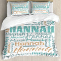 Turquoise typography bedding featuring an interlocking word collage in block and script fonts on white backdrop