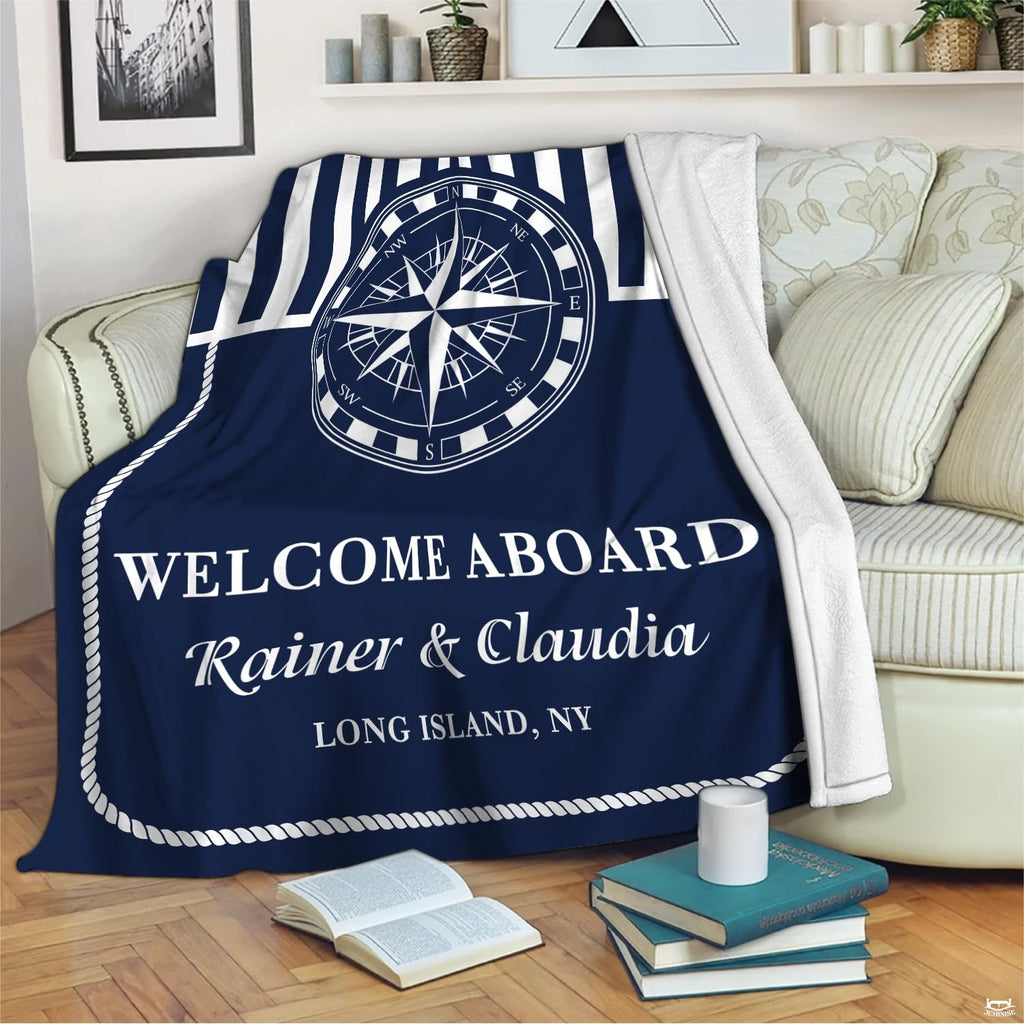 Living room decor setting featuring nautical compass throw blanket draped over sectional couch
