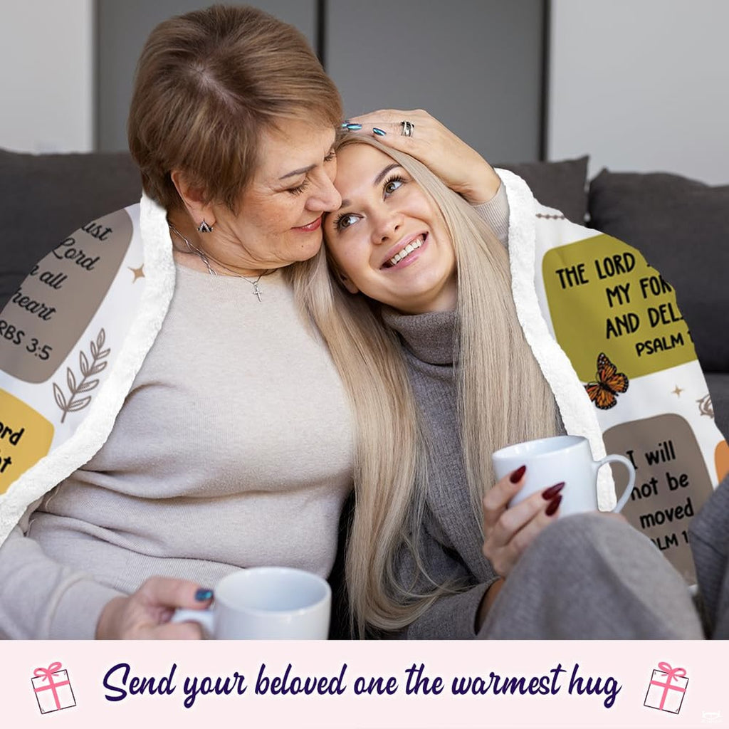 Devotional christian scripture hooded blanket draped over living room sofa