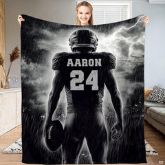 Monochrome gridiron storm football athlete blanket held up by woman