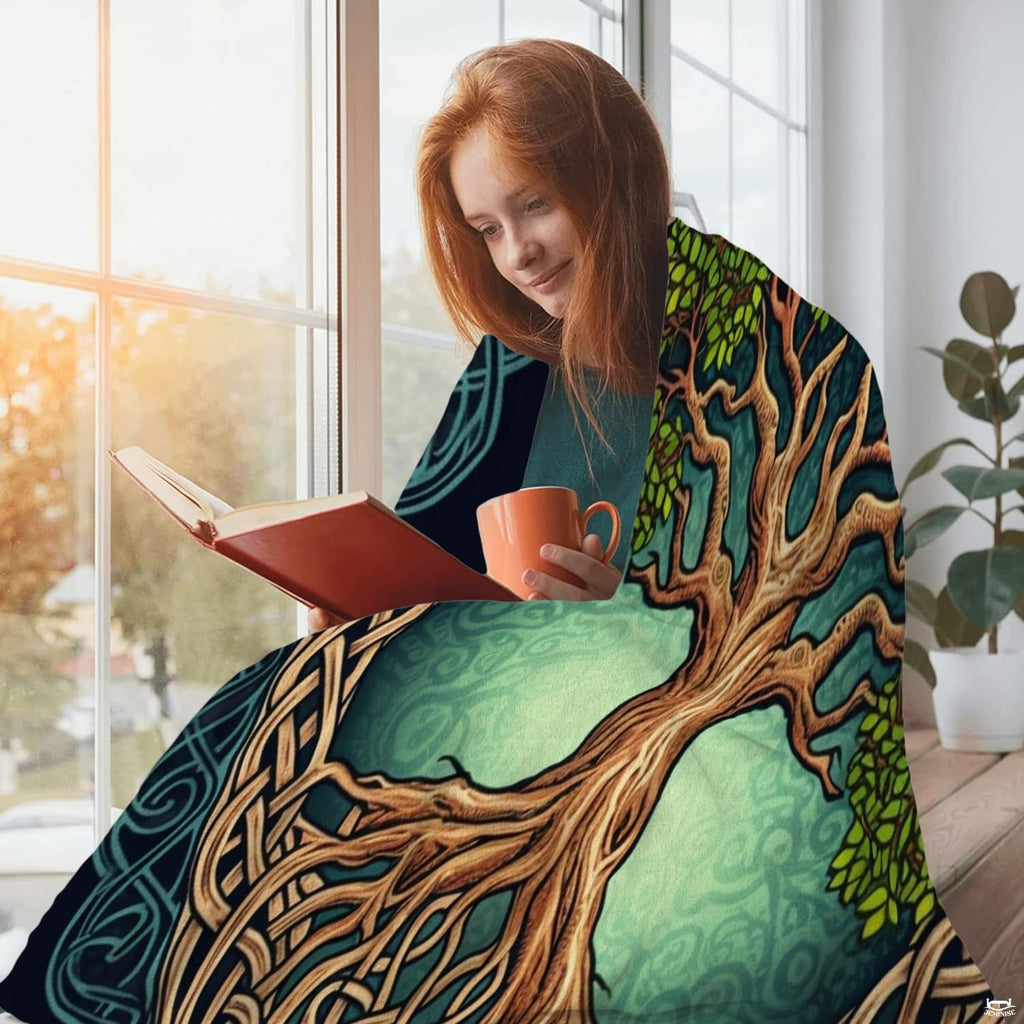Close-up of interlocking Celtic roots and teal filigree ornamentation on Tree of Life bedding.