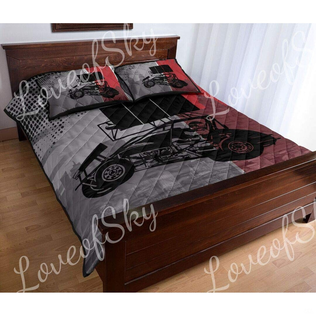 Side angle of sprint car bedding showing checkered flag motifs and racing typography across the bed