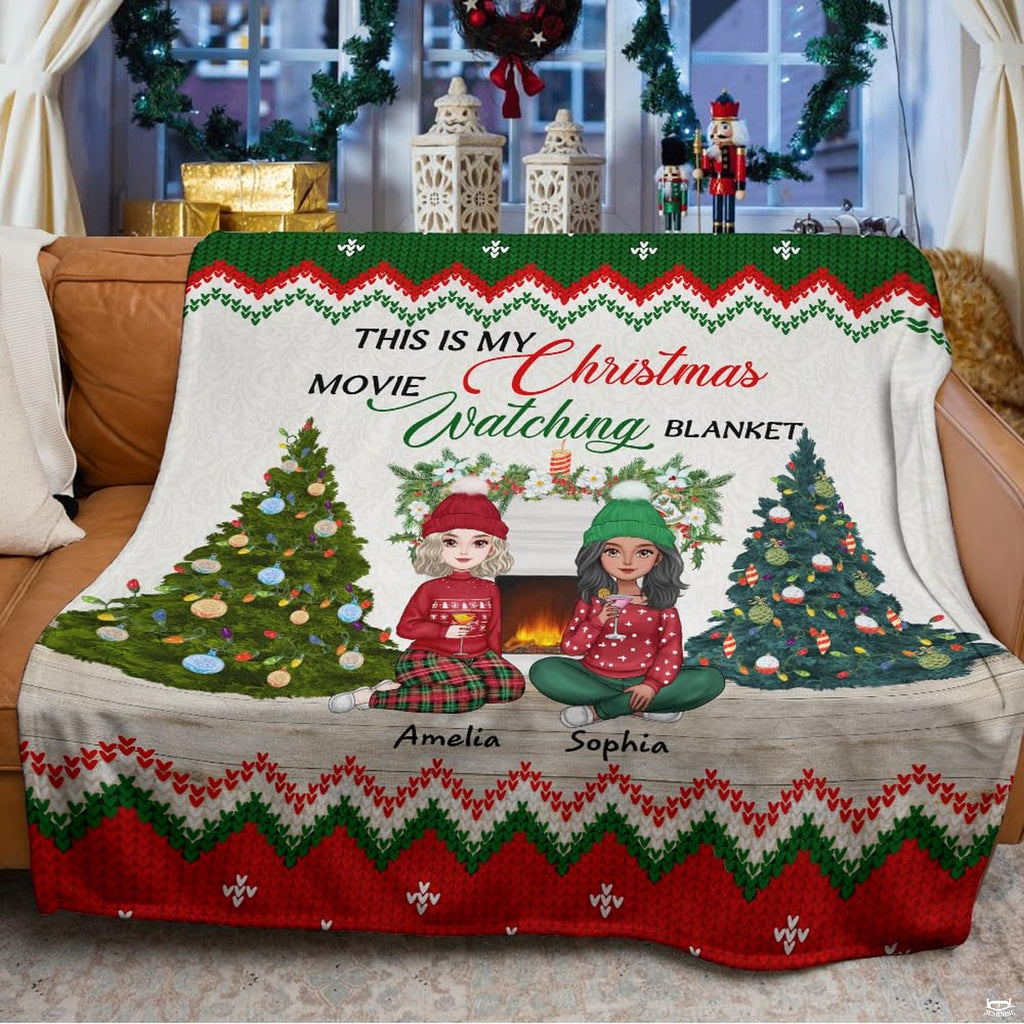 Festive holiday design displayed across seating in a decorated living room with seasonal accents.