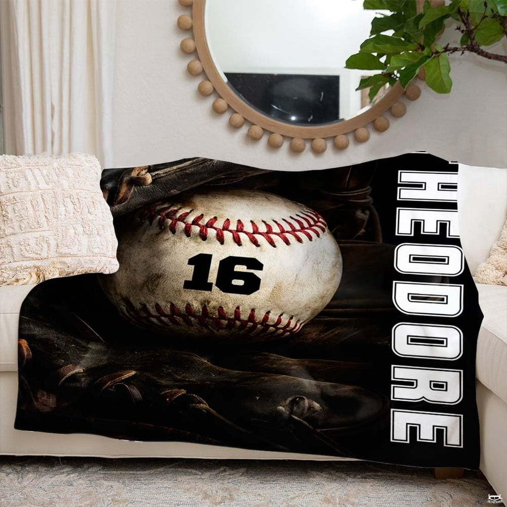 Baseball resting inside a dark fielder glove beside vertical white varsity lettering, view 6.