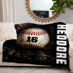 Baseball resting inside a dark fielder glove beside vertical white varsity lettering, view 6.