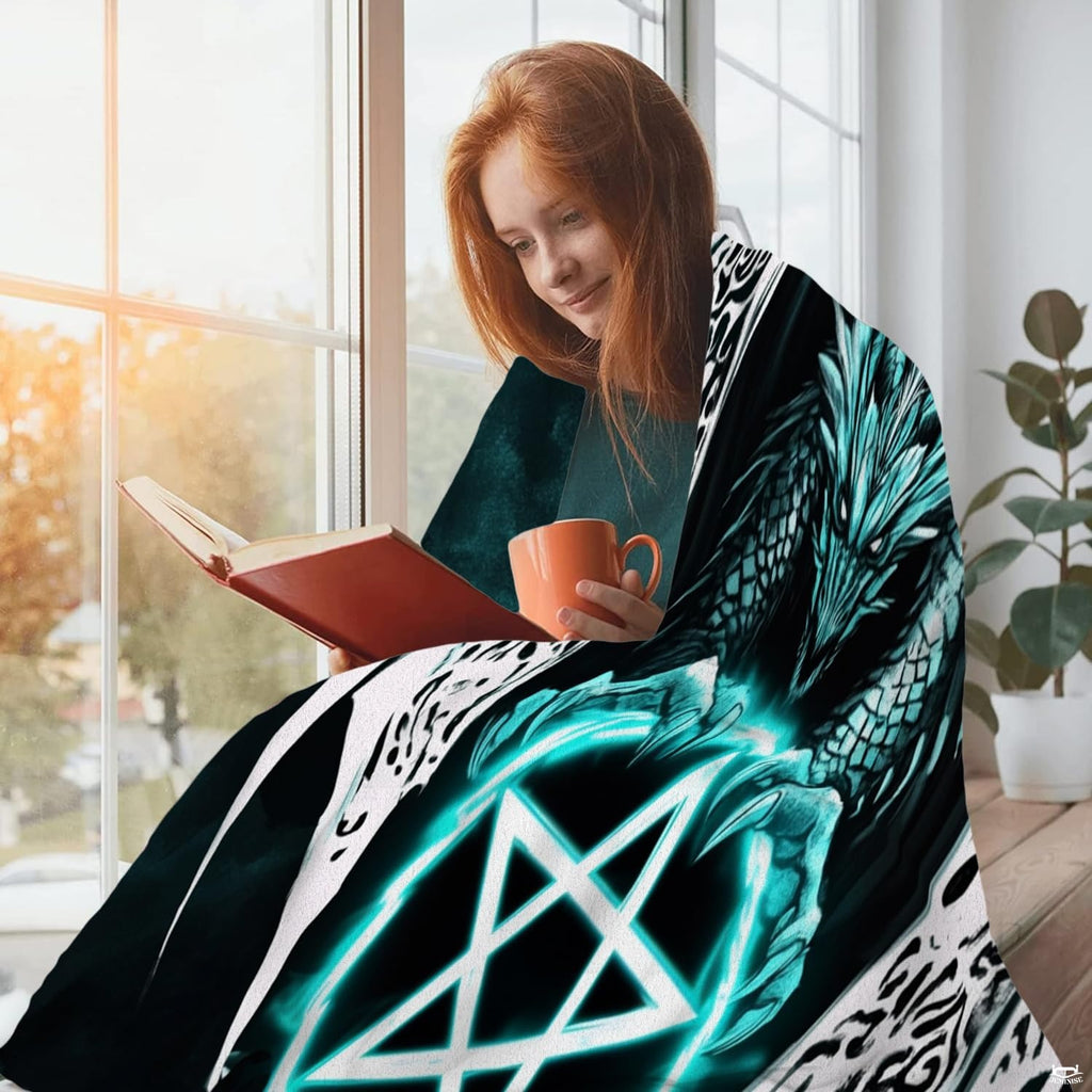 Gothic dragon pentagram throw blanket styled in a bright reading corner setting
