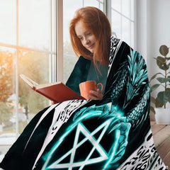 Gothic dragon pentagram throw blanket styled in a bright reading corner setting