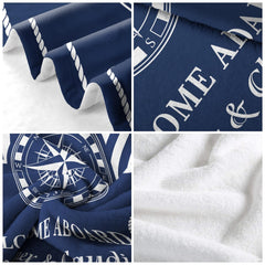 Nautical compass rose throw blanket folded neatly showing navy cabana stripes and rope edge