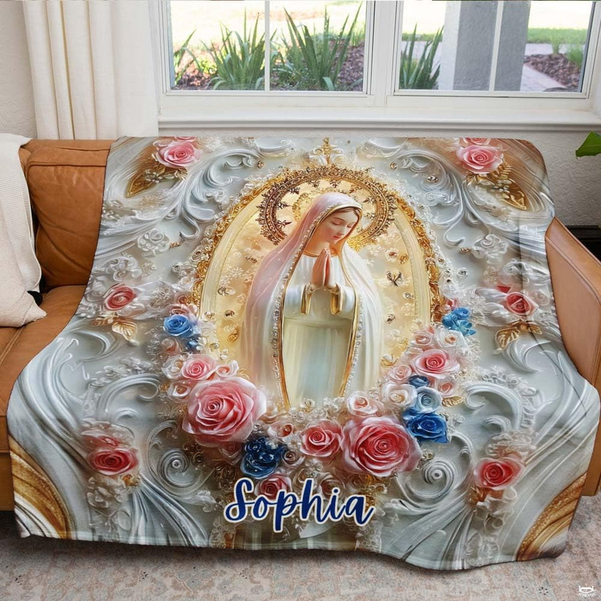 Our Lady of Fatima blanket draped across an armchair in a sunlit living room setting.