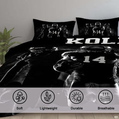 Corner angle view of athletic bedding illustrating sleek black and charcoal tones in a modern bedroom setting