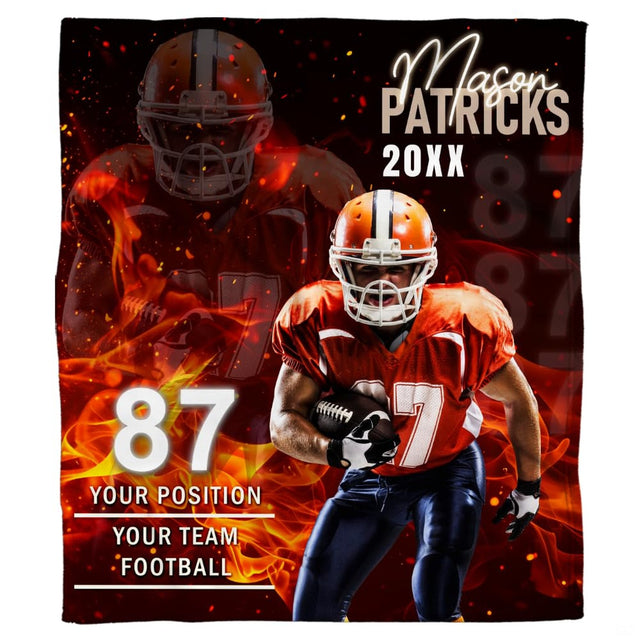Graphic blanket artwork showing athletic football runner bursting through roaring orange flames and embers.
