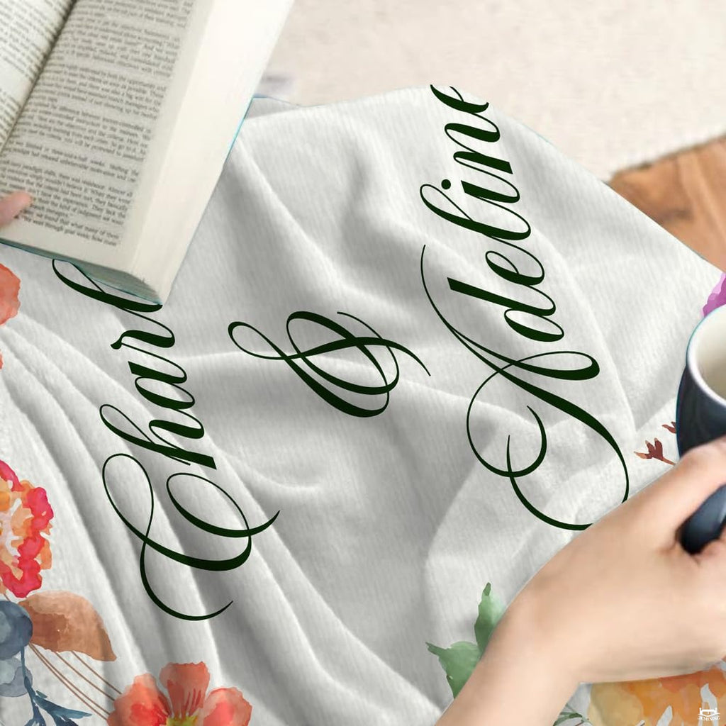 Complete bedroom display of wedding gift bedsheet accented by an artistic watercolor floral garland.