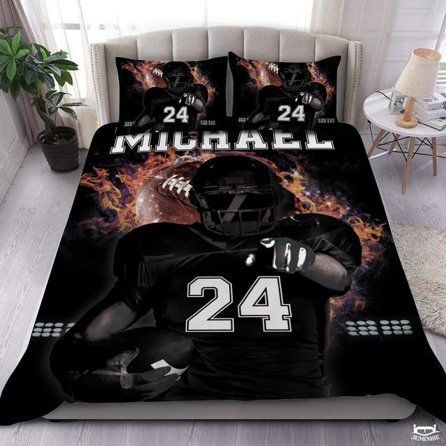 Flaming football player sports bedding set displayed on tufted bed in modern bedroom.