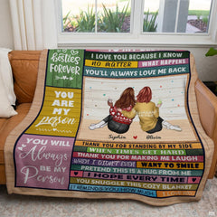 Living room display showing rustic companion signboard artwork draped across a sofa seat.