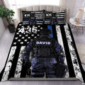 Rear-facing tactical figure over a distressed monochrome flag with white stars and vivid blue stripe