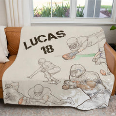 Football sports sketch throw blanket draped over brown leather living room sofa