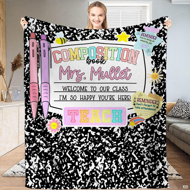 Marbled notebook throw blanket featuring black and white speckles, pastel pens, and doodle stickers.