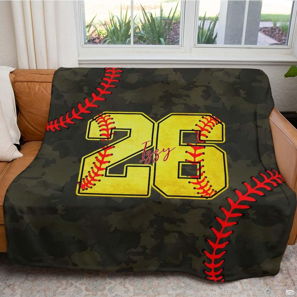 Decorative bedroom view showing baseball sports motifs against an olive green camouflage backdrop.