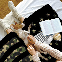 Bedroom display featuring camo American flag bedding paired with serene wabi sabi decor elements.