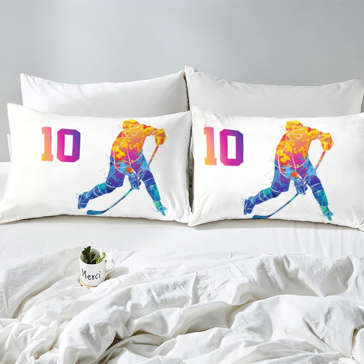 Side angle view of athletic winter sports bedding showing royal purple and golden yellow tones on mattress