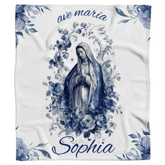 Flat graphic layout showing central Marian portrait encircled by blooming blue botanical roses and script.