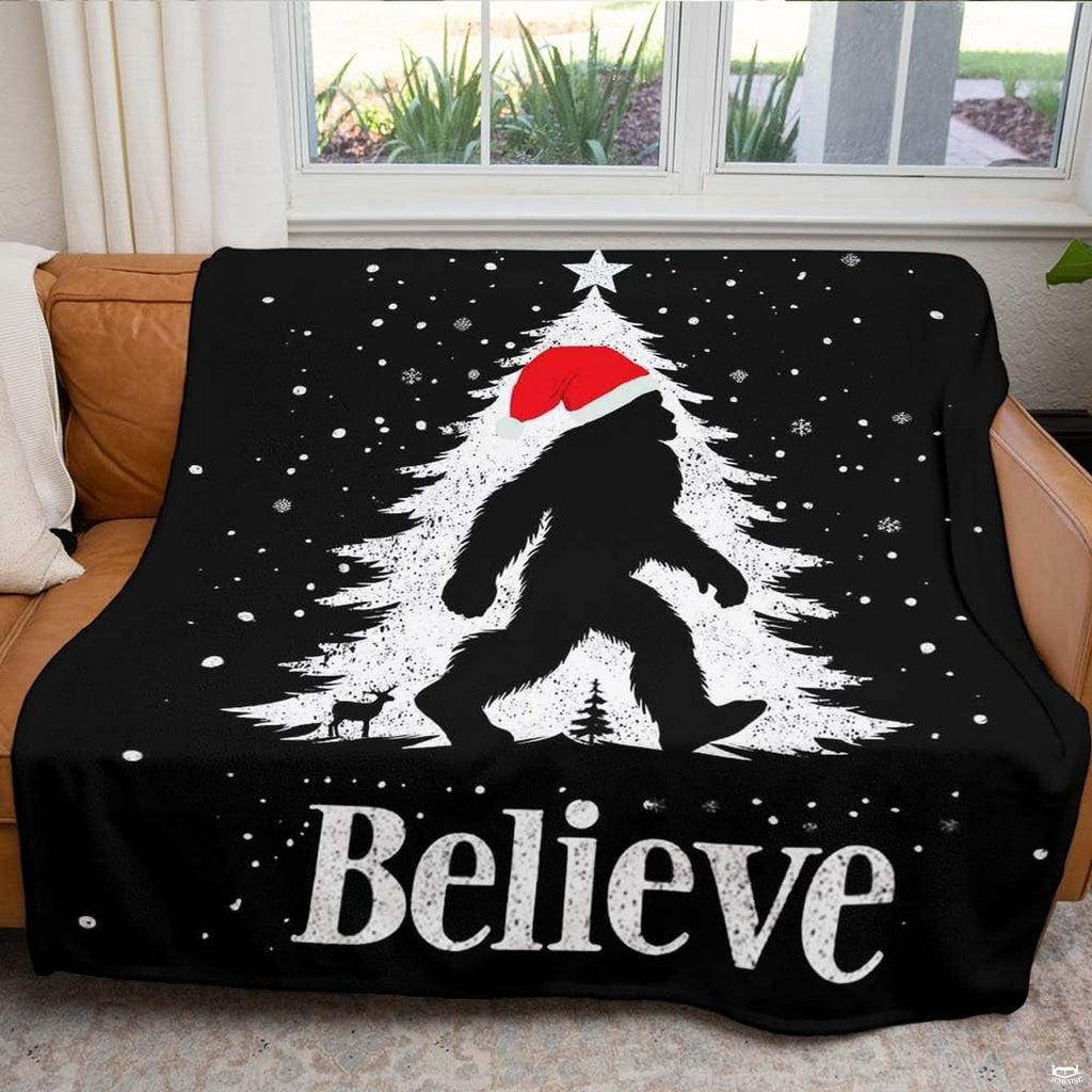 Christmas Bigfoot throw blanket view 5 highlighting Santa hat silhouette, falling snow, and festive tree