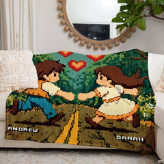 Folded pixel art romantic forest throw blanket resting on wooden table displaying retro game art
