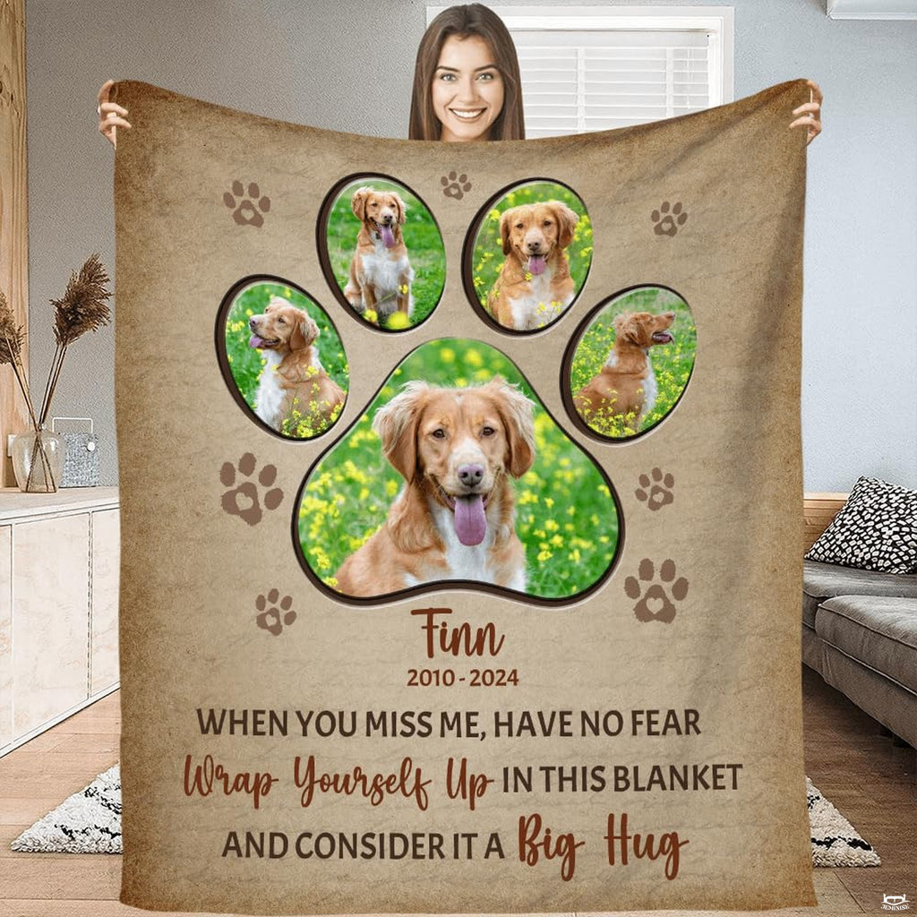 Front view of golden retriever dog memorial throw blanket held upright showcasing paw collage artwork.