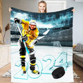 Ice hockey player taking a slapshot in a floodlit arena stadium, view 1.
