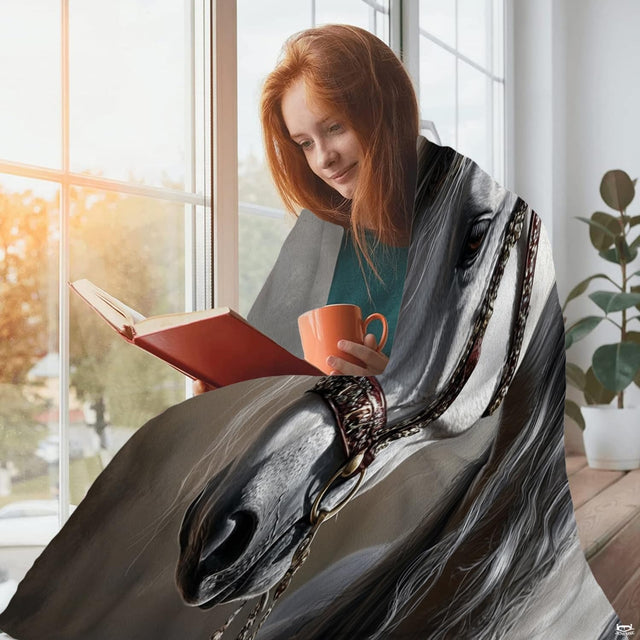 Equestrian portrait design displayed indoors beside a hot beverage near a sunlit window.