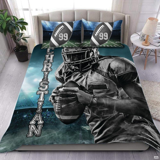 Steel grey football sports bedding featuring textured football graphic and yard lines on a bed