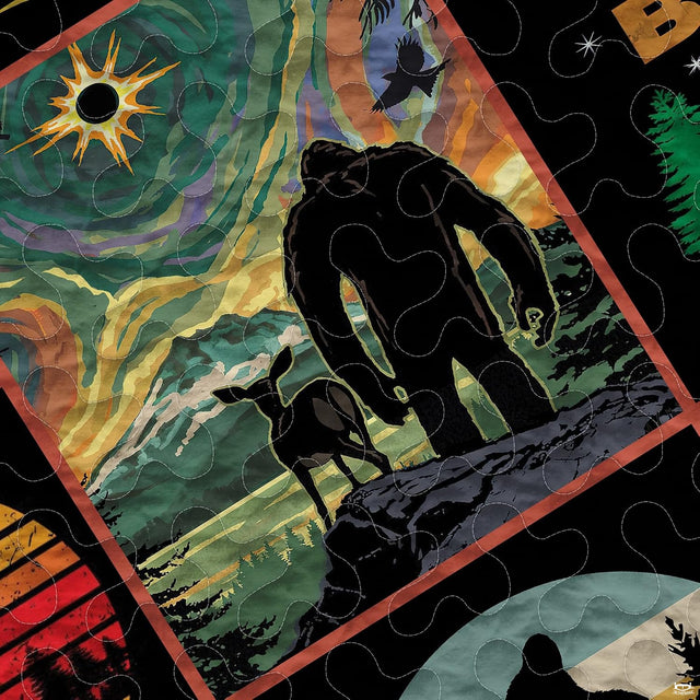 Close-up view of vintage ape silhouette graphic panels on dark wilderness bed sheets.