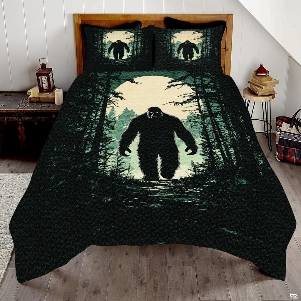 Sunset Bigfoot bedding featuring a walking Sasquatch silhouette and glowing amber dusk sky on a bed