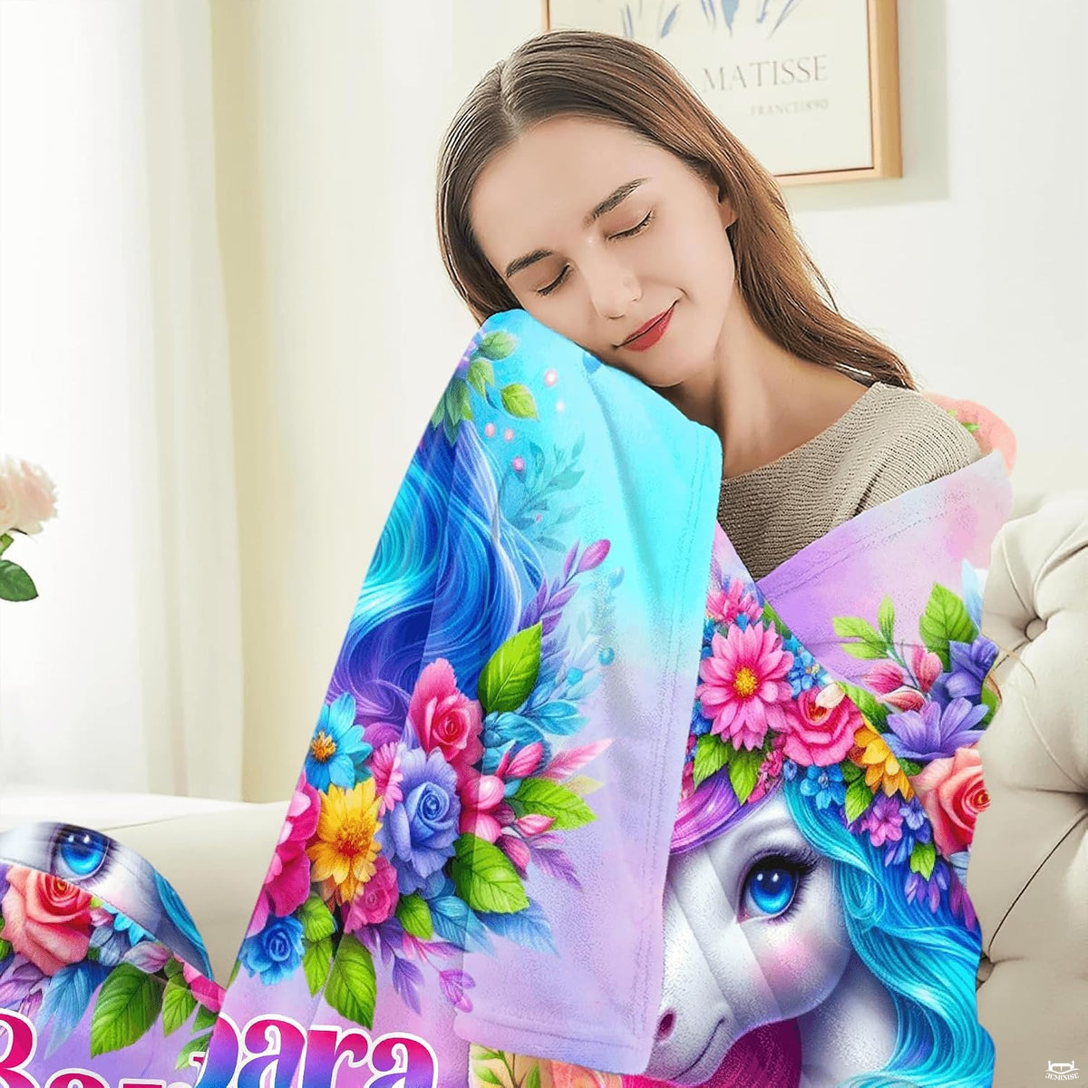 Close-up perspective of blooming flower wreath and crystal horn on unicorn throw blanket