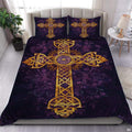 Golden Celtic cross bedding set featuring interlacing ribbon knotwork over deep purple foliage in a stylish bedroom.